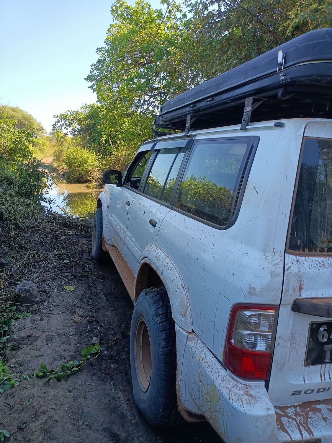 4x4 crossing a muddy remote track in Madagascar